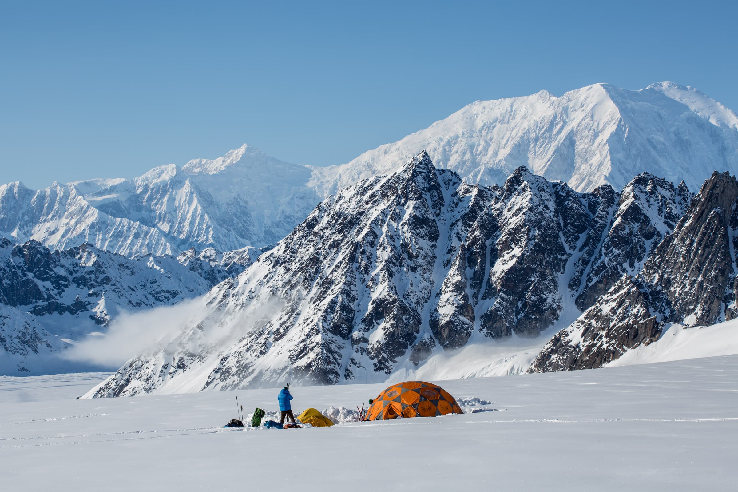 Glacier camp below massive Alaskan peaks