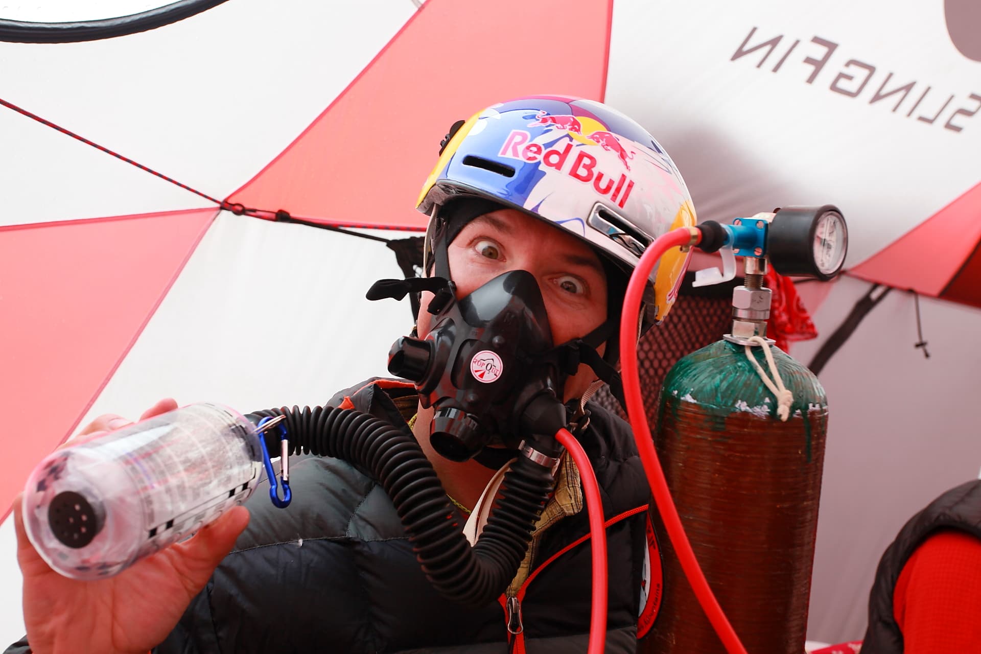 Chris Davenport with Red Bull helmet and oxygen mask at altitude