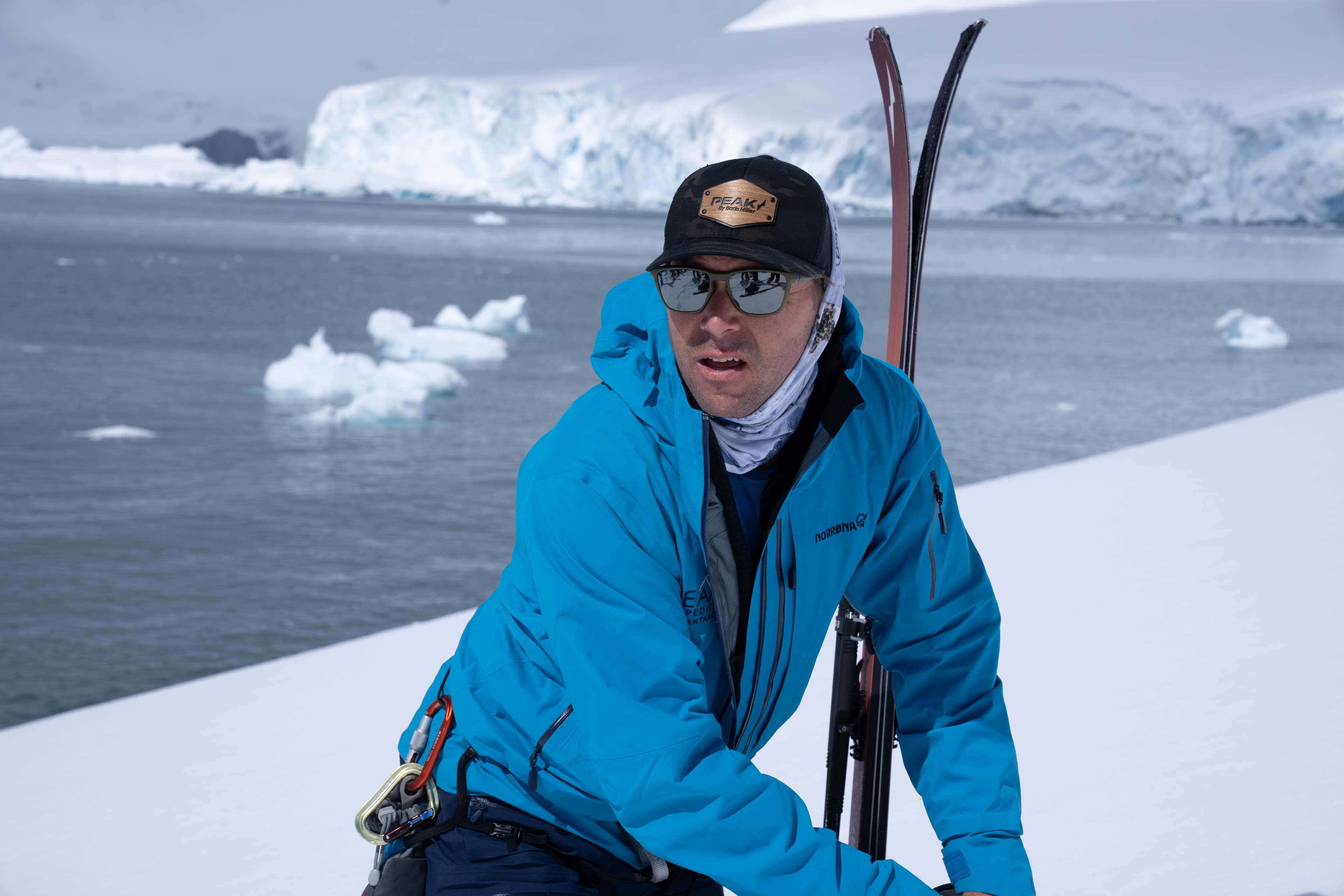 Chris Davenport with glacier and icebergs behind
