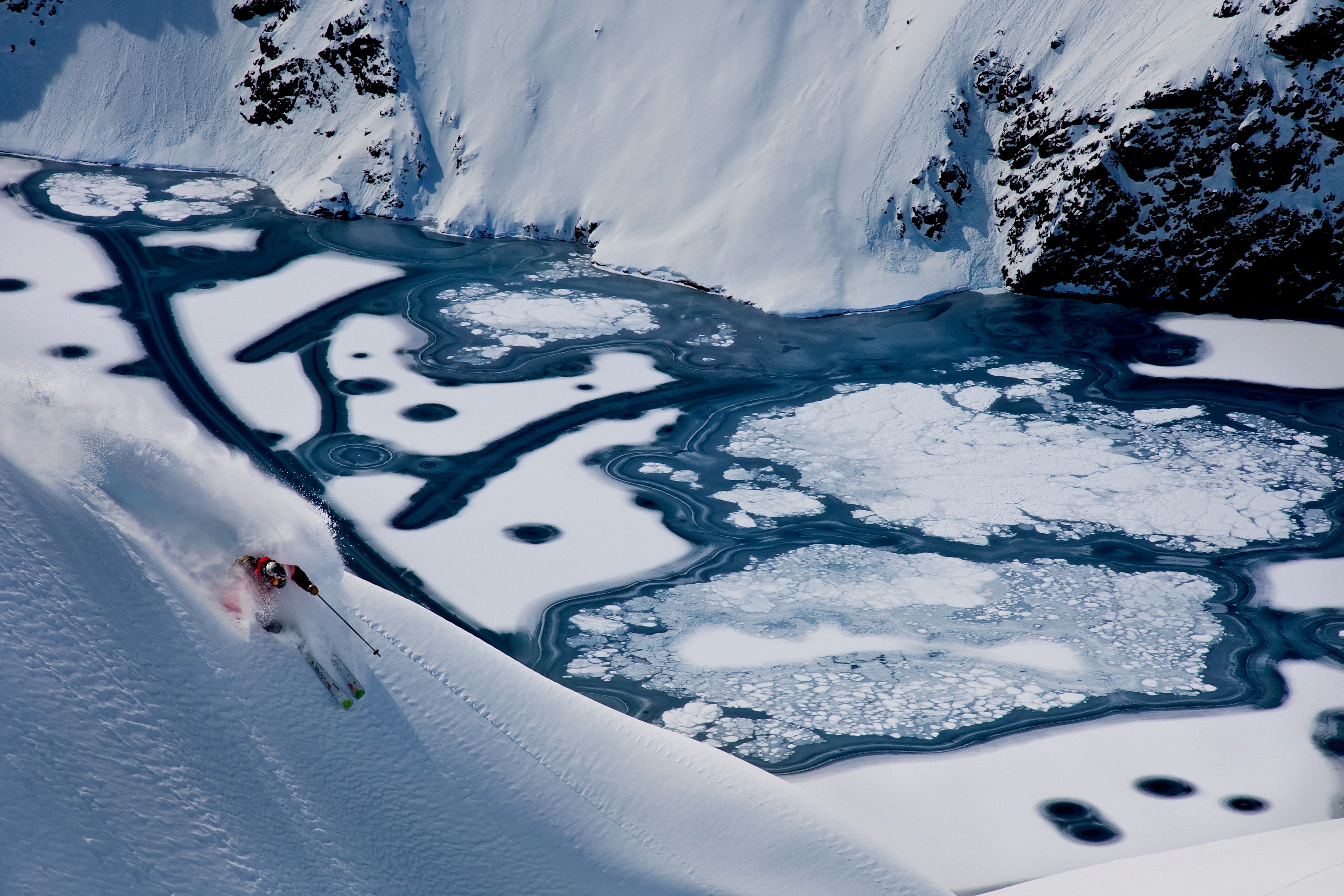Aerial view of a skier above the frozen Portillo lake