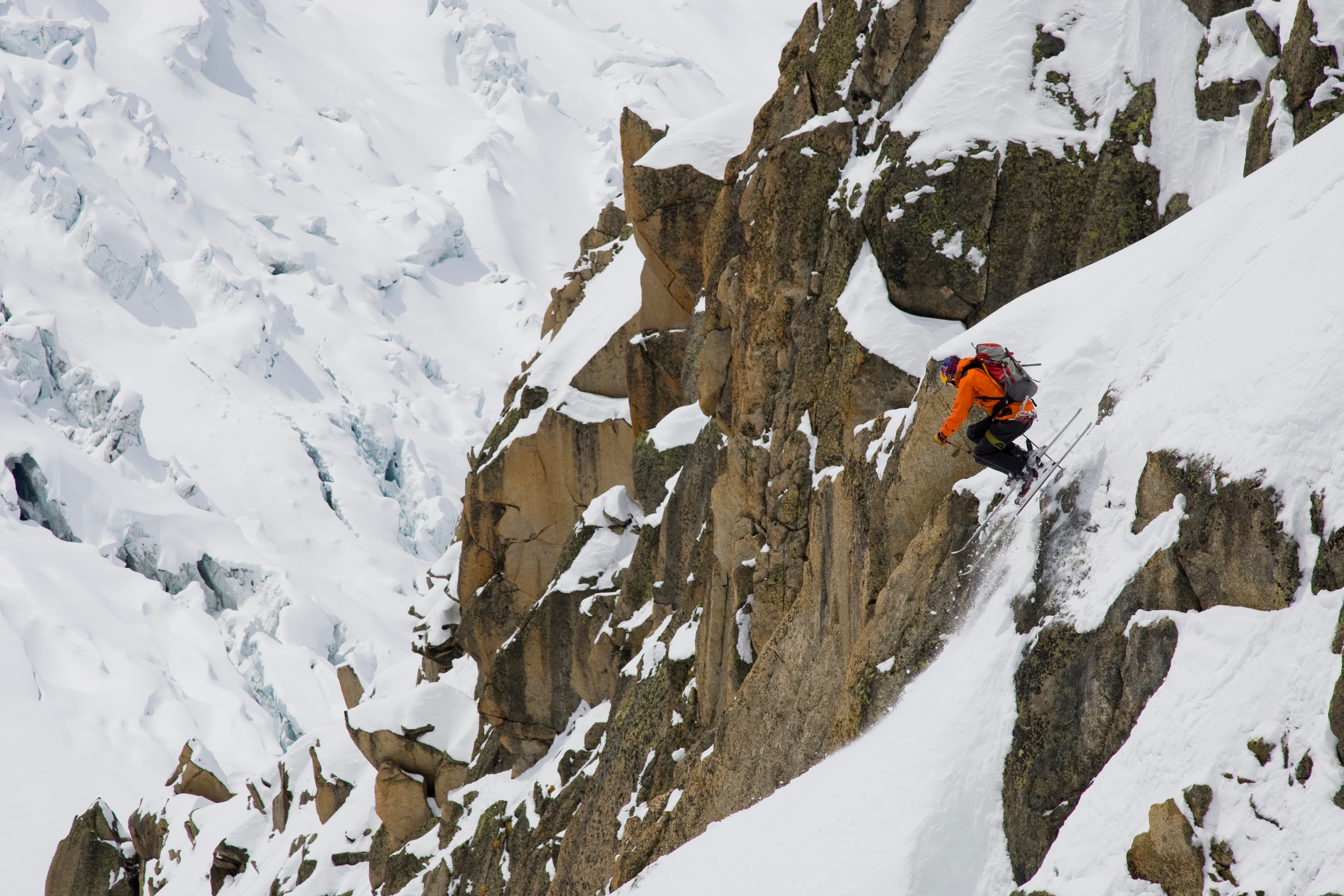 Chris Davenport skiing a rocky technical couloir